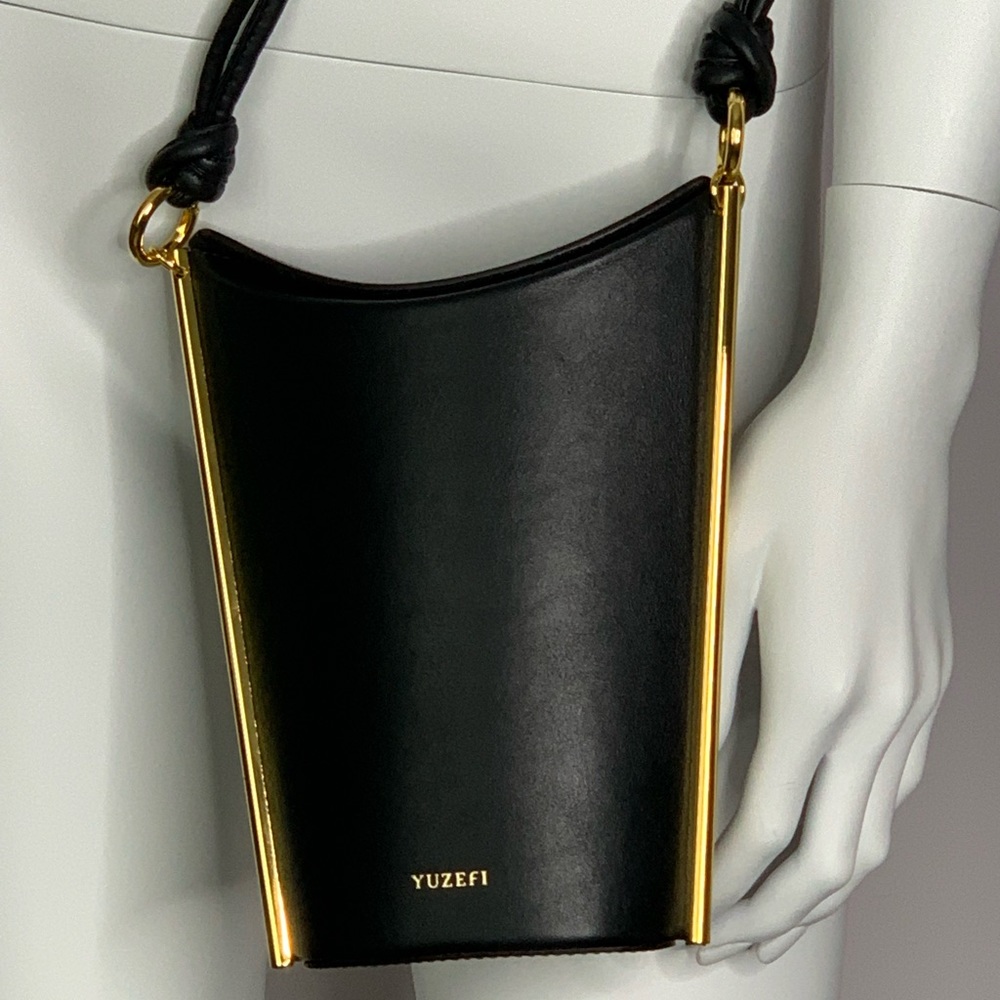 YUZEFI pitta shoulder bag in Black.